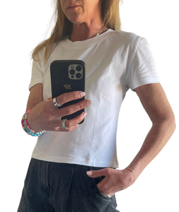 Woman wearing a white cotton t-shirt with black jeans